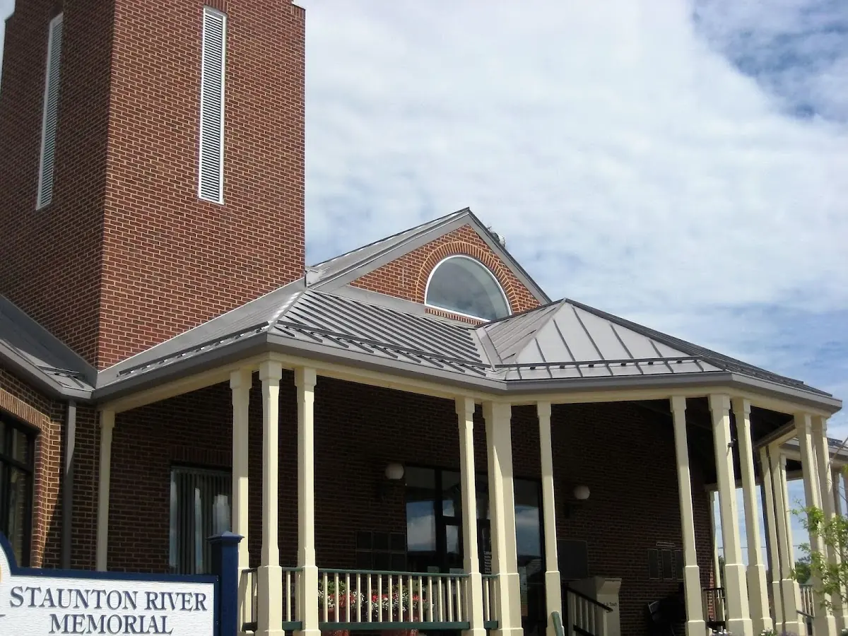 Skilled roofing craftsmen working on a residential roof in Clemson University